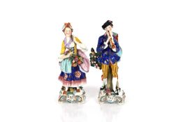 A pair of Sampson Chelsea style porcelain figures, depicting a musician and flower seller with