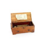 ** Online video available ** An early 19th Century Swiss music box, drop end key wind, playing four