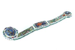 A Chinese porcelain Ruyi sceptre with dragon and phoenix decoration, 49.6cm long