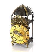 A 17th Century brass and steel cased lantern clock, 32cm high