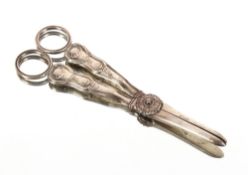 A pair of Victorian silver grape scissors, having floral and shell decoration, family crest,