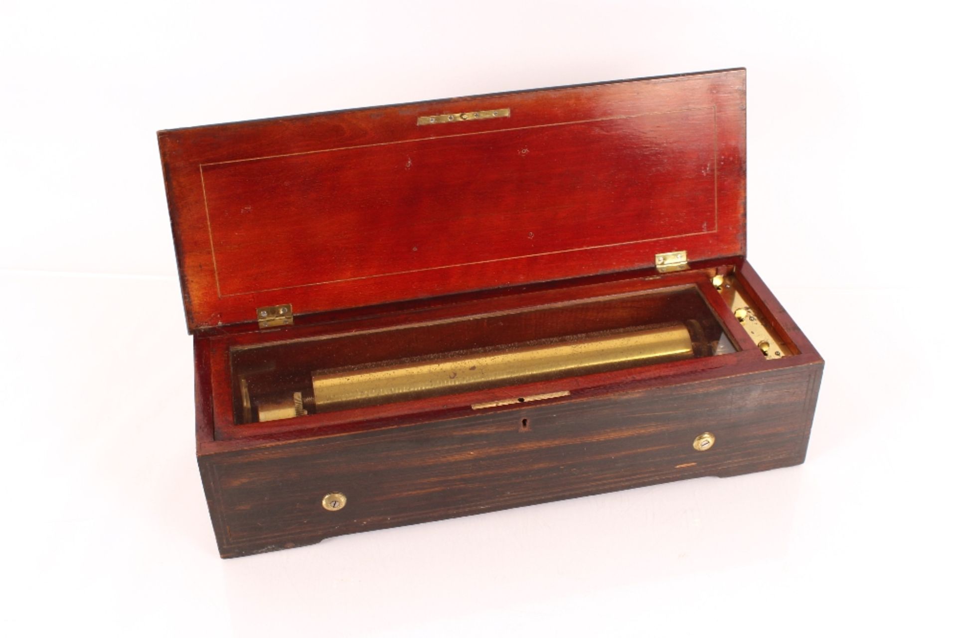 A Swiss music box by Le Coultre, playing six airs in rosewood and satin wood strung case, 13"