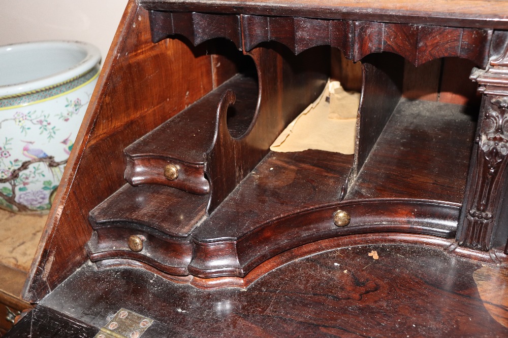 A large 19th Century continental carved rosewood bureau, the fall front opening to reveal an - Image 6 of 14
