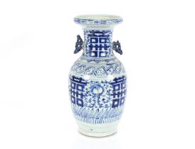 A 19th Century blue and white Chinese baluster vase, having symbol decoration flanked by pierced