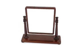 A Victorian mahogany swing toilet mirror, the rectangular plate raised on decorative turned supports