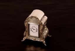 An Edwardian silver cased mantel timepiece, by William Comyns enclosing a French movement Hallmarked