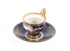 A Vienna style porcelain chocolate cup and saucer, decorated with a panel of a battle scene on