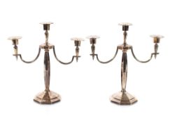 A pair of plated three light candelabra, 36cm high
