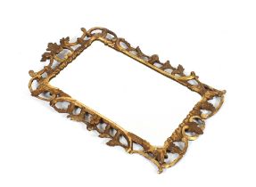 An 18th Century gilt framed wall mirror, decorated C scrolls and leaves, 83cm x 52cm in extremes