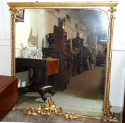 A large late 19th Century gilt framed over mantel mirror, with leaf and spiral twist decoration with