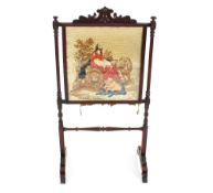 A 19th Century mahogany framed fire screen, the needlework panel depicting an allegorical scene