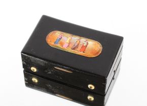 A 19th Century tortoiseshell musical snuff box, with sectional comb, the lid decorated with an