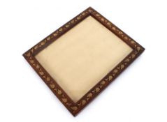 A good quality wooden frame inlaid with brass leaves