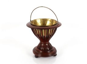 A Dutch hour glass shaped kettle / peat brazier with lift out brass liner, raised on ball feet, 36cm