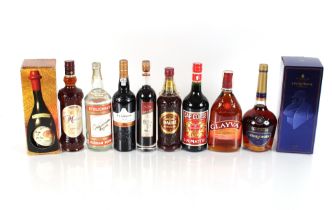 A collection of spirits to include port, vodka, Courvoisier, Glayva, and five various aperitives