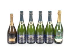 Four bottles of Autréau-Lasnot Champagne; a bottle of President Champagne; and a bottle of