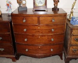 A Georgian mahogany bow fronted  chest of two short and three long graduated drawers, raised on