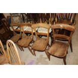 A set of four elm seated bar back dining chairs