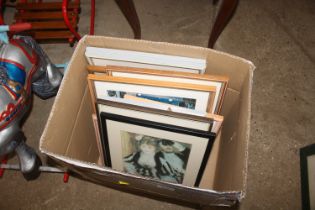 A box of various pictures and prints