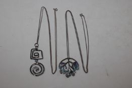 A 925 silver modernist pendant hung to a fine link