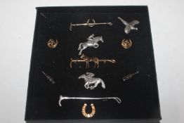 A pair of cuff-links in the form of bottles; anoth