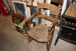 An elm seated rocking chair