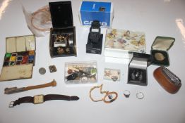 A box containing coinage, jewellery, Casio wrist watch, artist box etc.