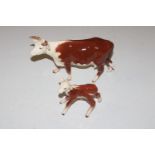 A Beswick model of a Hereford cow and calf AF and restored
