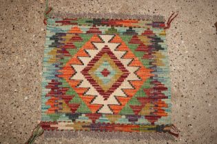 An approx. 1'5" x 1'6" Chobi Kelim rug