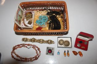 A basket of various costume jewellery