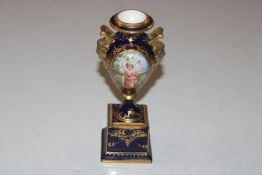A Vienna style porcelain twin handled urn decorate