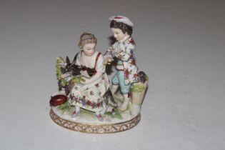 A Dresden porcelain group depicting two children and a goat