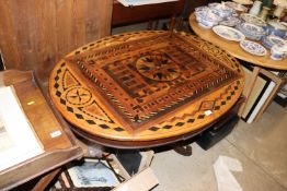 A 19th Century French marquetry oval table raised