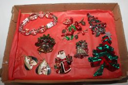 A box of Christmas brooches