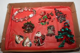 A box of Christmas brooches