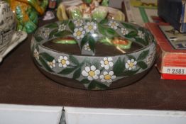 A clear glass bowl with painted decoration of flow