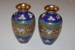 A pair of cloisonné decorated vases