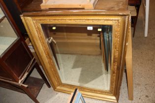A bevel edged oblong wall mirror contained in 19th