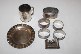 A silver dish; a silver Christening mug; a silver