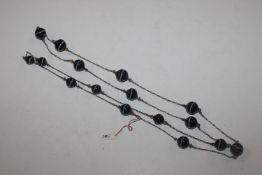 A white metal and agate necklace