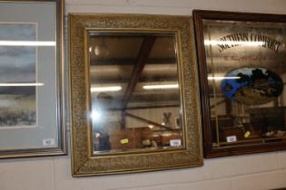 A gilt framed wall mirror