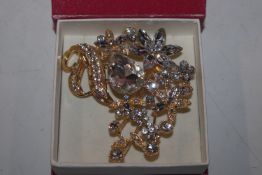 A large crystal set floral brooch