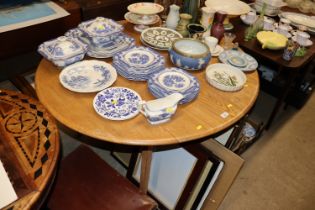 An blond Ercol drop leaf dining table