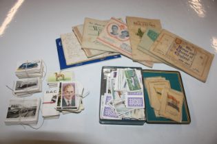 A box containing cigarette cards and albums