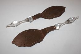 A pair of Arts & Craft type copper fish servers with glass handles