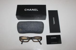 A boxed pair of Chanel glasses with case