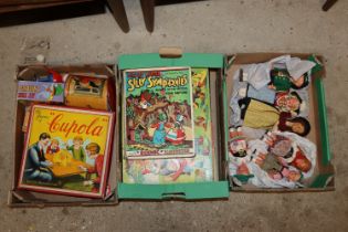 A box of souvenir dolls; a box of various games an