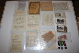 A £1, a 10 shilling note, WWII Medals and various ephemera