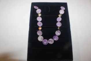 A Stauer amethyst coloured bead necklace