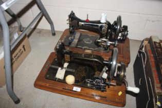 Two Frister & Rossman sewing machines, lacking cas